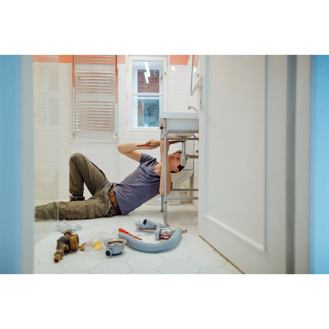 Plumber fixing a drain - General Plumbing